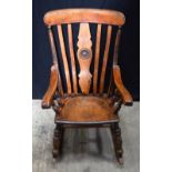 An antique wooden rocking chair.93 x 57 x 72 cm.