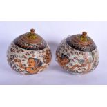 AN UNUSUAL PAIR OF 19TH CENTURY CARVED AND PAINTED MIDDLE EASTERN JARS AND COVERS painted with figur