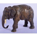 AN ANTIQUE EUROPEAN BRONZE FIGURE OF AN ELEPHANT with ivory tusks. 9 cm x 12 cm.