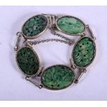 AN EARLY 20TH CENTURY CHINESE SILVER AND JADEITE BRACELET. 18 grams. 14 cm long.