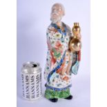 A 19TH CENTURY JAPANESE MEIJI PERIOD AU KUTANI PORCELAIN FIGURE OF A MALE modelled holding a gourd.