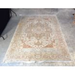 A large ivory ground Oriental rug. 277 x 184cm