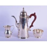 A THREE PIECE SILVER COFFEE SET by Spink & Sons. 1130 grams. London 1976 to 1979. Largest 24 cm x 20