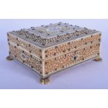 A 19TH CENTURY ANGLO INDIAN CARVED IVORY AND SANDALWOOD CASKET. 11 cm square.