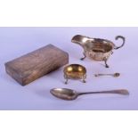 A 1920S SILVER SAUCEBOAT together with a silver box, spoon and salt. 740 grams overall. London 1797