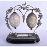 A RARE 19TH CENTURY AUSTRALIAN SILVER PLATED DOUBLE EMU EGG ORNAMENT modelled with a standing kangar