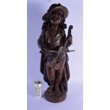 A LARGE 19TH CENTURY EUROPEAN BRONZE FIGURE OF A MUSICIAN modelled upon a naturalistic base. 64 cm x