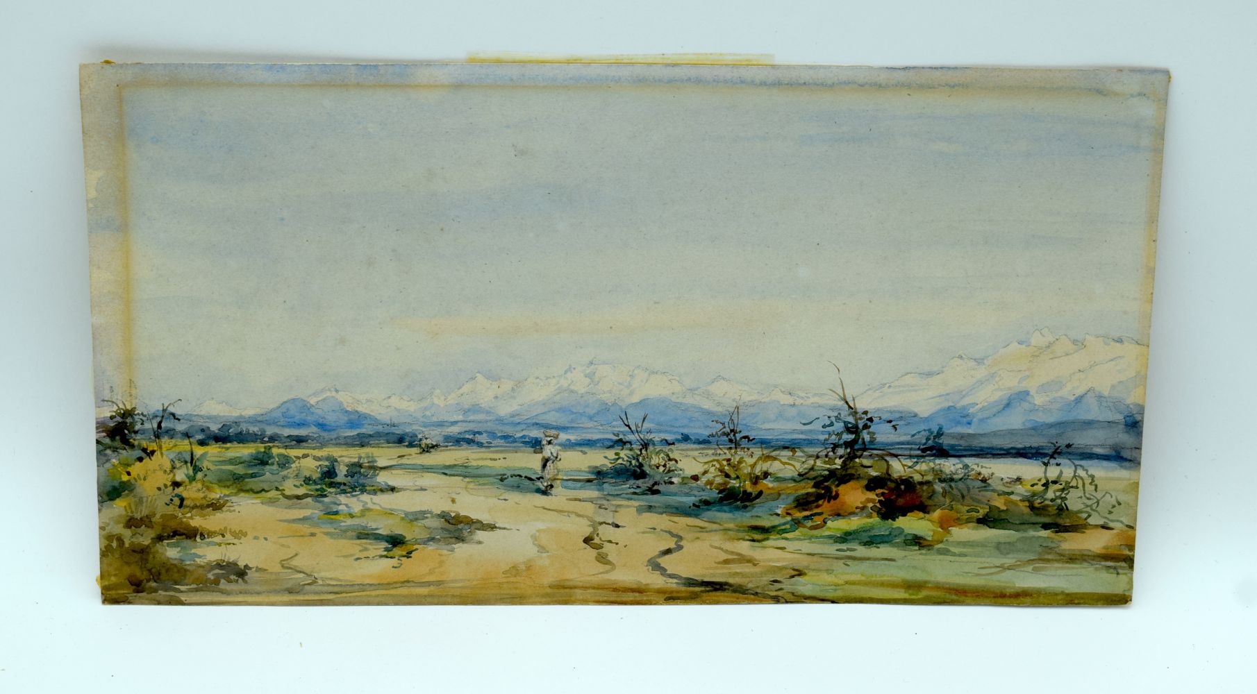 A small 19th century watercolour of a figure in a mountainous land scape .17 x 33cm.