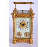 A 19TH CENTURY FRENCH BRASS MULTI DIAL CARRIAGE CLOCK with repousse dial. 16 cm high inc handle.