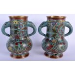 A PAIR OF 19TH CENTURY CHINESE CLOISONNE ENAMEL VASES decorated with birds and foliage. 18 cm x 15 c