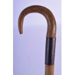 A RARE 19TH CENTURY CONTINENTAL CARVED RHINOCEROS HORN BANDED WALKING CANE of tapering form. 679 gra