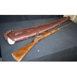 A Tower lock Musket together with a contemporary gun bag. 130cm. (2)