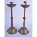 A STYLISH PAIR OF WMF ARTS AND CRAFTS SILVER PLATED CANDLESTICKS. 26 cm high.