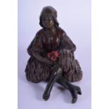 A CONTEMPORARY COLD PAINTED BRONZE FIGURE OF A FEMALE modelled with crossed legs. 11 cm x 6 cm.