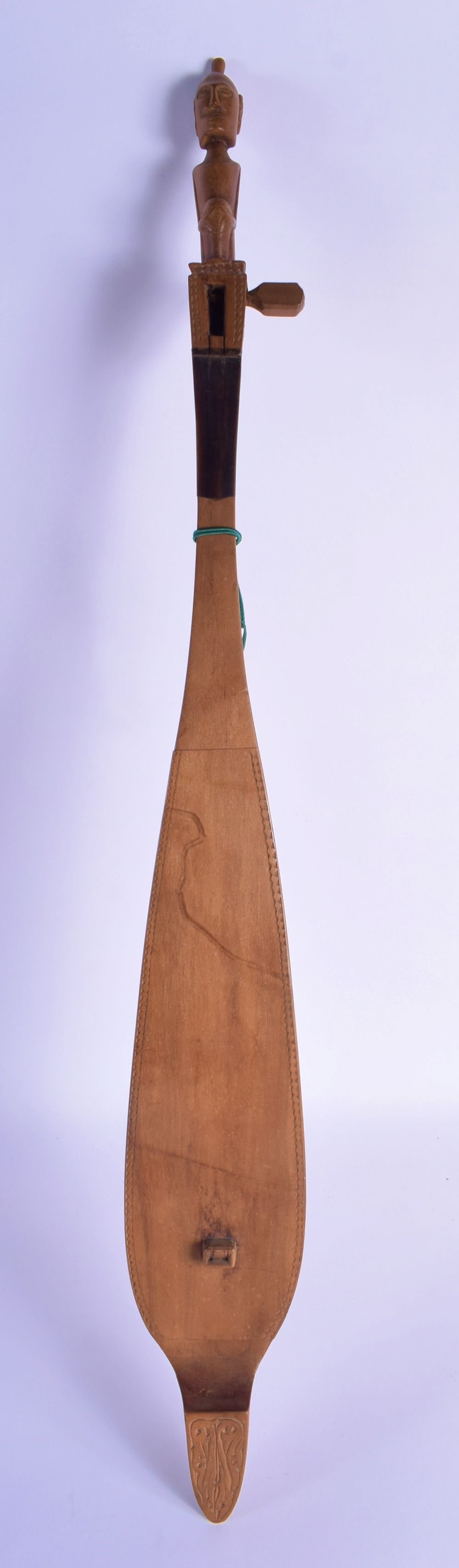 AN UNUSUAL VINTAGE TRIBAL CARVED WOOD MUSICAL INSTRUMENT in the shape of a boat. 68 cm long.