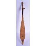 AN UNUSUAL VINTAGE TRIBAL CARVED WOOD MUSICAL INSTRUMENT in the shape of a boat. 68 cm long.
