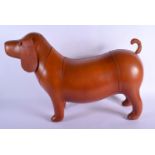 A CONTEMPORARY BROWN LEATHER DOG. 70 cm x 36 cm.