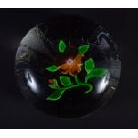 A 19TH CENTURY FRENCH GLASS SINGLE FLOWER PAPERWEIGHT Attributed to Clichy. 6.75 cm diameter.