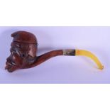 A RARE 19TH CENTURY COLONIAL CARVED WOOD PIPE modelled as a male. 13 cm long.