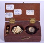 AN UNUSUAL BOXED GROUP OF ANTIQUE TREASURES including a compass nut. 8 cm x 4.5 cm.