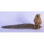 A CONTEMPORARY BRONZE INKWELL formed as an owl standing upon a leaf. 33 cm x 13 cm.