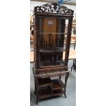 A Hongmu faux bamboo display cabinet on stand, 19th century, the open work intertwined three quarter