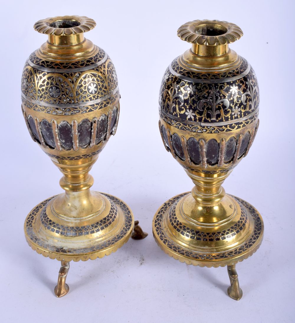 A PAIR OF 18TH /19TH CENTURY INDIAN SILVER INLAID COCONUT SHELL VASES decorated with foliage and vin