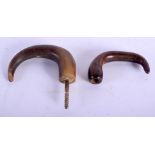 TWO 19TH CENTURY MIDDLE EASTERN CARVED RHINOCEROS HORN HANDLES. Largest 11 cm x 7 cm. (2)