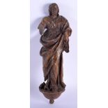 A 17TH/18TH CENTURY EUROPEAN CARVED WOOD FIGURE OF A SAINT modelled in robes. 30 cm high.