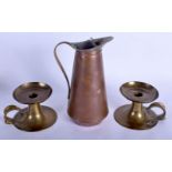 AN ARTS AND CRAFTS J W BENSON COPPER JUG together with a pair of brass sticks. Largest 24 cm high. (