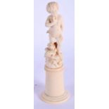 A 19TH CENTURY EUROPEAN DIEPPE CARVED IVORY FIGURE OF A PUTTI modelled standing upon flowers. 22 cm