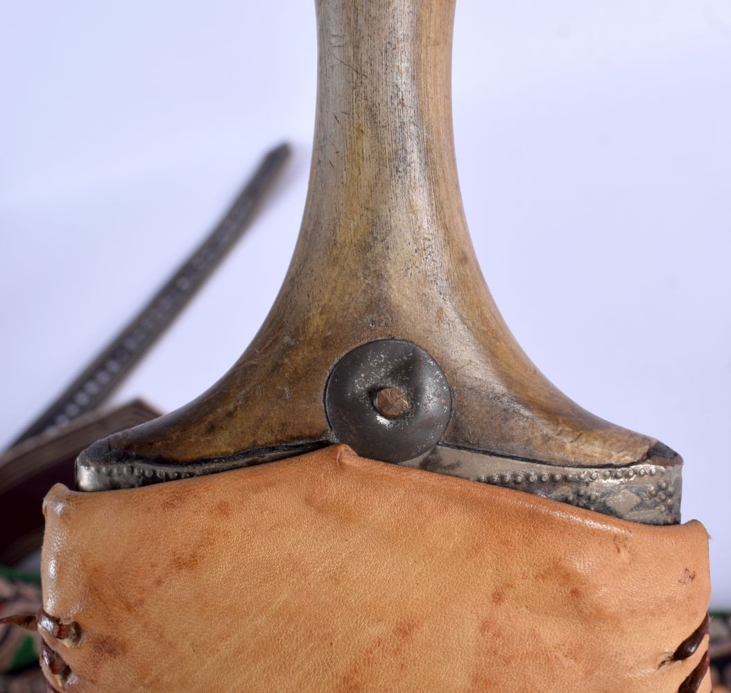 TWO LATE 19TH CENTURY MIDDLE EASTERN OMANI CARVED RHINOCEROS HORN JAMBIYA DAGGERS with silk and leat - Image 6 of 18