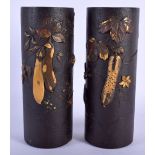 A GOOD PAIR OF 19TH CENTURY JAPANESE MEIJI PERIOD IRON VASES decorated in relief with fruiting vines