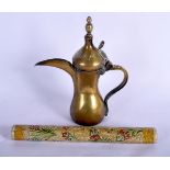 AN ANTIQUE OMANI BRASS COFFEE POT together with a Persian lacquered scroll box and cover. Largest 32