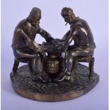 A 19TH CENTURY RUSSIAN BRONZE FIGURE OF TWO SEATED MALES modelled playing a game. 11 cm x 11 cm.