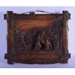 A RARE 19TH CENTURY BAVARIAN BLACK FOREST CARVED WOOD PLAQUE depicting figures upon a horse. 37 cm x