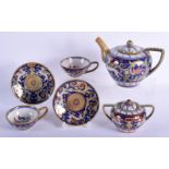AN EARLY 20TH CENTURY ITALIAN FAIENCE HISPANO MORESQUE TYPE LUSTRE TEASET painted with dragons. Larg