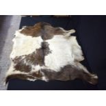 A goat skin rug 91 x 84 cm.