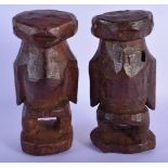 AN UNUSUAL PAIR OF AFRICAN TRIBAL FIGURES. 21 cm high.