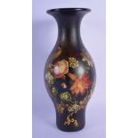 A LARGE EARLY VICTORIAN BLACK LACQUER VASE painted with a bird amongst foliage. 27 cm high.