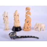 FOUR 19TH CENTURY ANGLO INDIAN CARVED IVORY BUDDHISTIC FIGURES together with a painted enamel pipe.