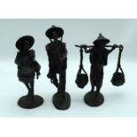 A group of three bronze South East Asian figures of males. 25cm (3).