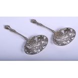 A PAIR OF STERLING SILVER GRAPE VINE SPOONS. 74 grams. 12 cm x 6.5 cm.