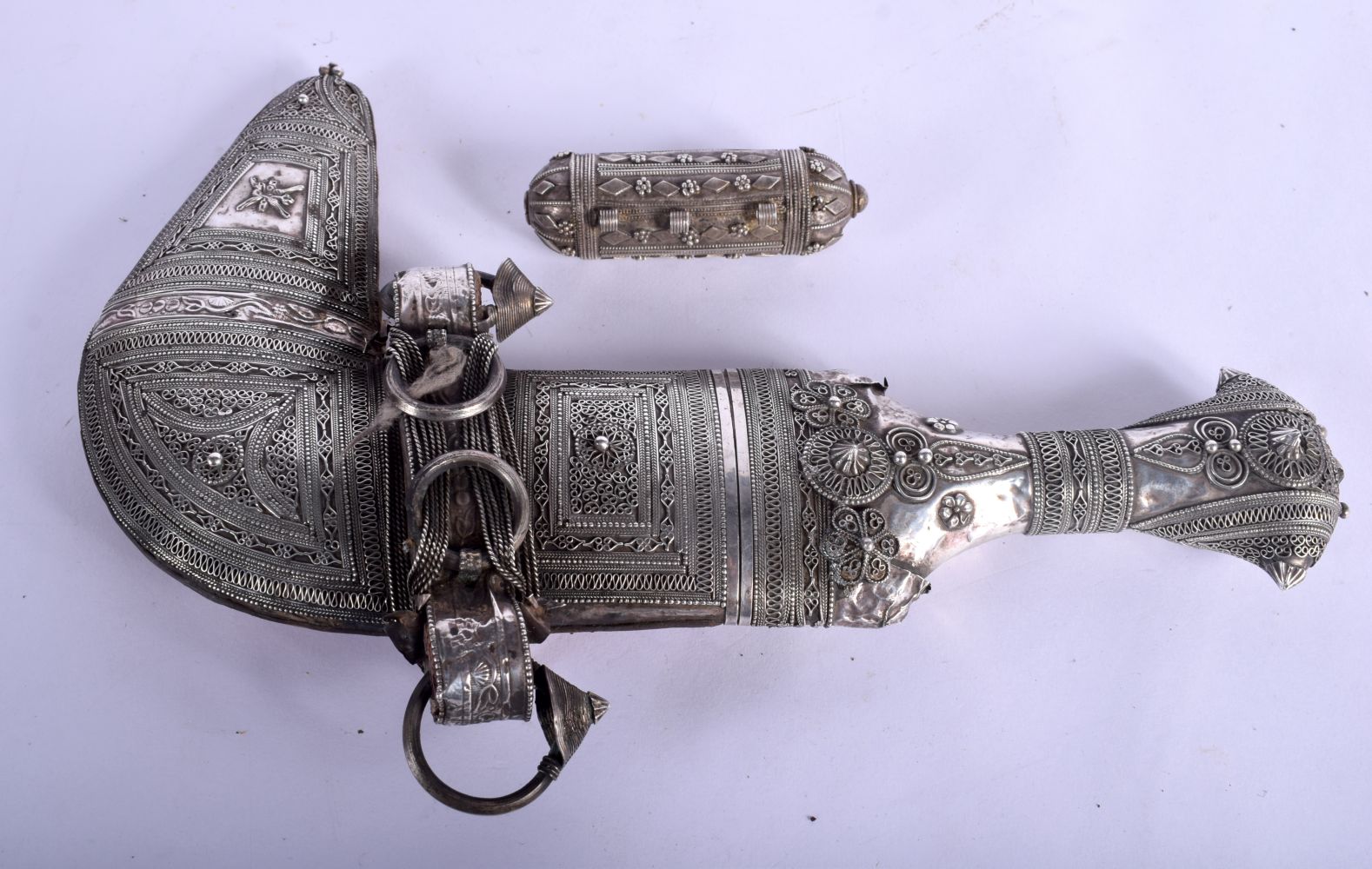 A 19TH CENTURY MIDDLE EASTERN OMANI JAMBIYA DAGGER overlaid with white metal. 36 cm long. 26 cm long - Image 3 of 3