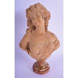 A 19TH CENTURY FRENCH TERRACOTTA BUST OF A CLASSICAL FEMALE modelled upon a veined marble bust. 30 c