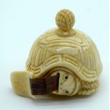 A small bone tape measure in the form of a Tortoise 4cm