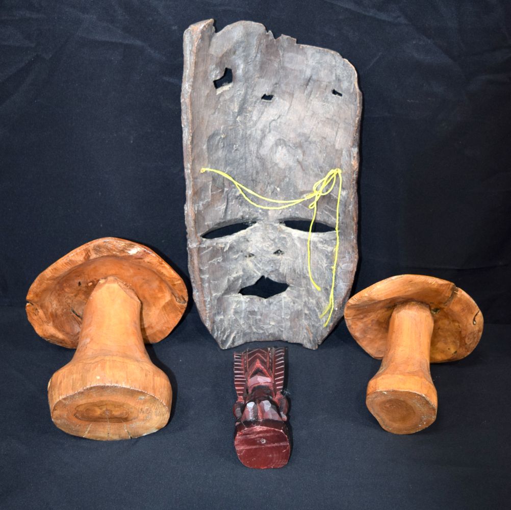 A large carved hardwood African mask, together with two carved wooden mushrooms and a small wooden t - Image 5 of 9