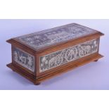 AN ANTIQUE ANGLO INDIAN SILVER INLAID WOOD AND IRON CASKET decorated with elephants and landscapes.