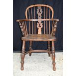 A small 19th century wooden Windsor chair. 87 x 57cm