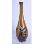 A 19TH CENTURY JAPANESE MEIJI PERIOD BRONZE AND SILVER OVERLAID VASE by Inoue, decorated with storks
